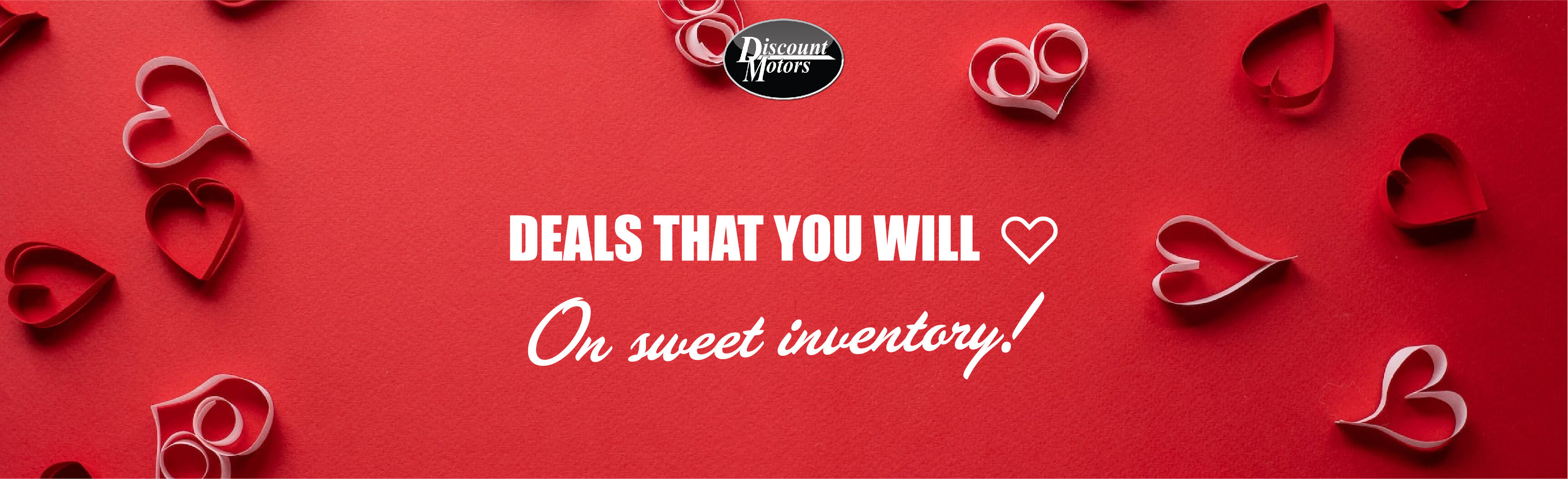 Paper-cut hearts littered on a table with advert slogan. Fall in love with our great deals.